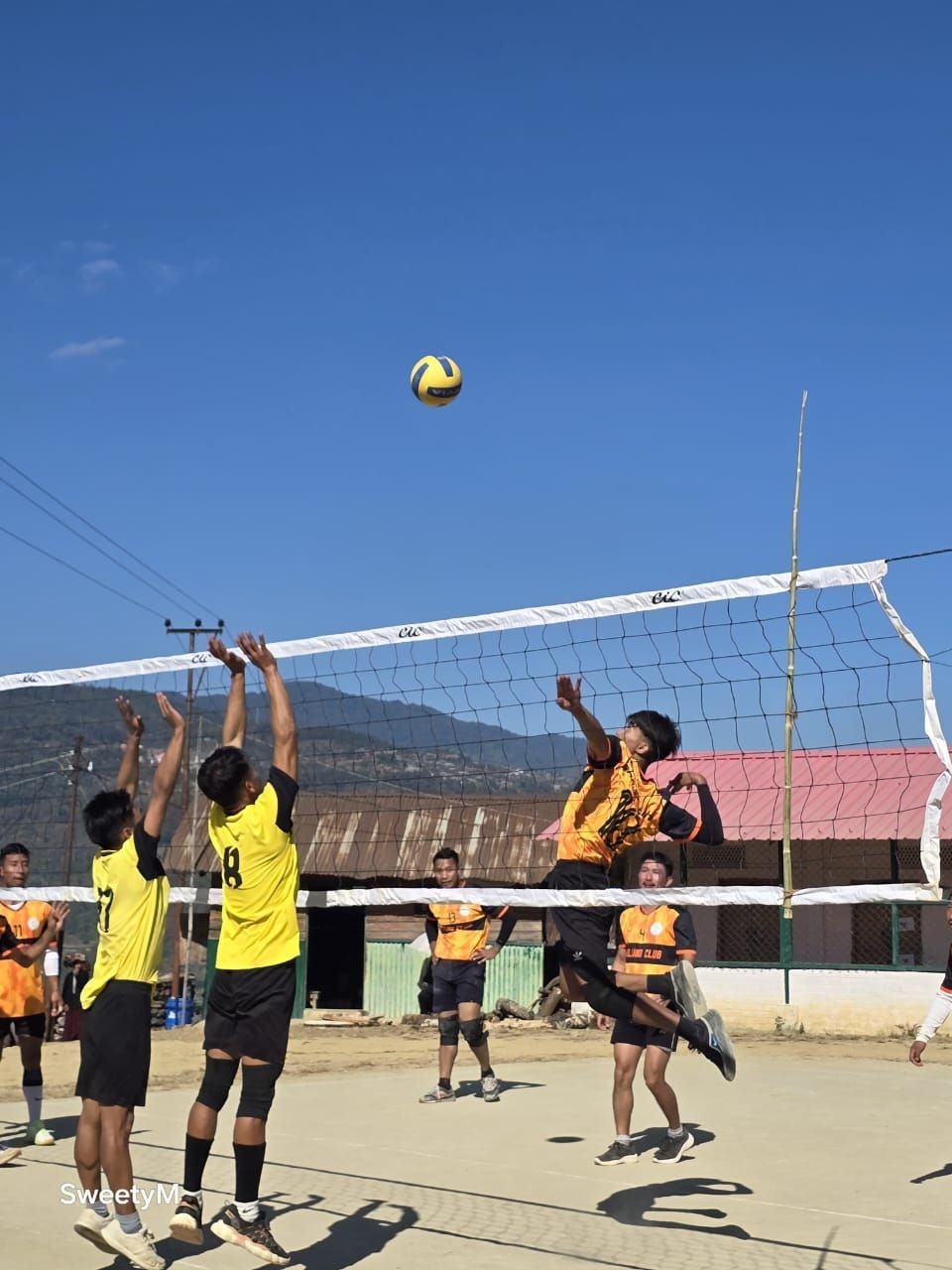 A volleyball match in progress during the 9th Edition Open Volleyball Tournament held at Enhulumi. (Photo Courtesy: Sweety Mary Lyngba)